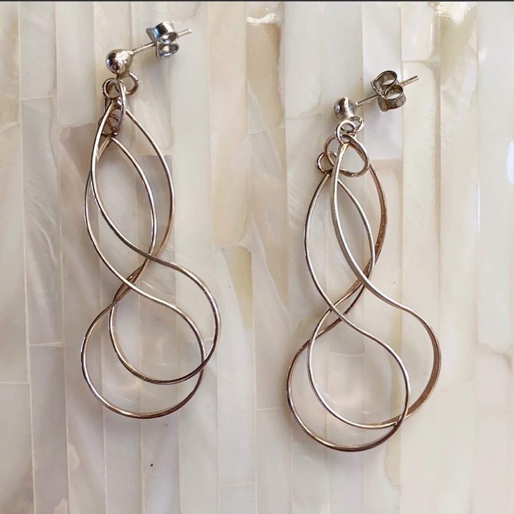 Silver swirl hoop earrings. Never worn!